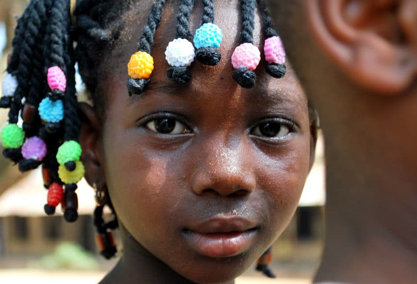 Child with colorful beads